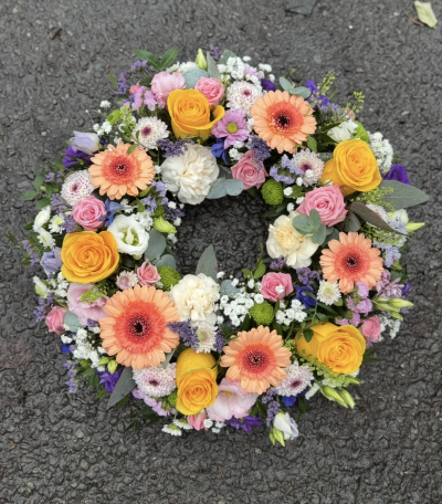 Florist choice wreath - A wreath funeral tribute -  colours will be similar to photo unless stated otherwise