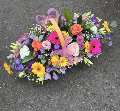 Mother’s Day trug - A basket arrangement in oasis , in a mix of colours and flowers