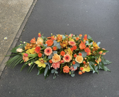 Single ended orange spray - A single ended casket spray 
With a mix of oranges and peaches